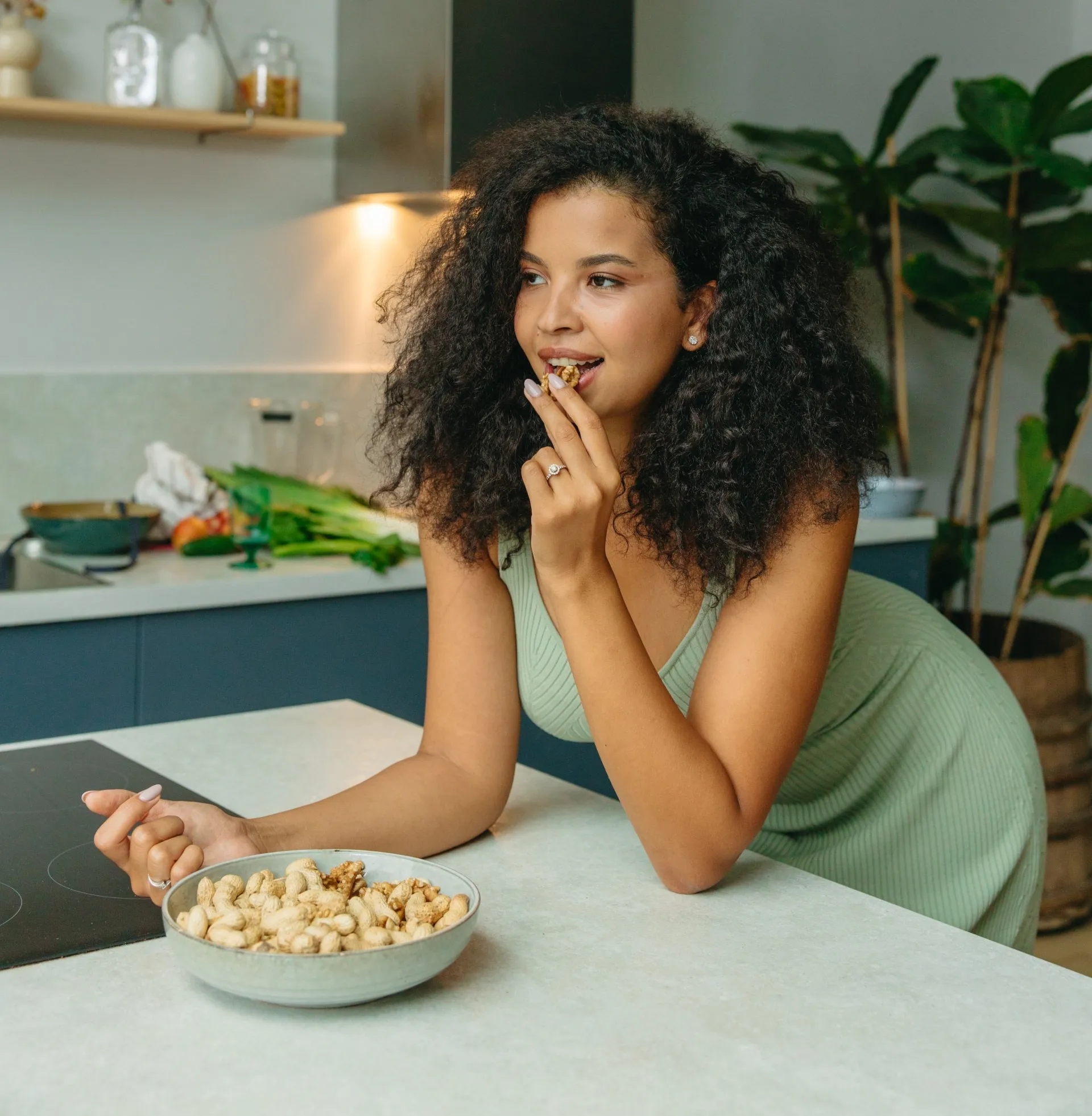 Person eating food during an allergy lifestyle consultation
